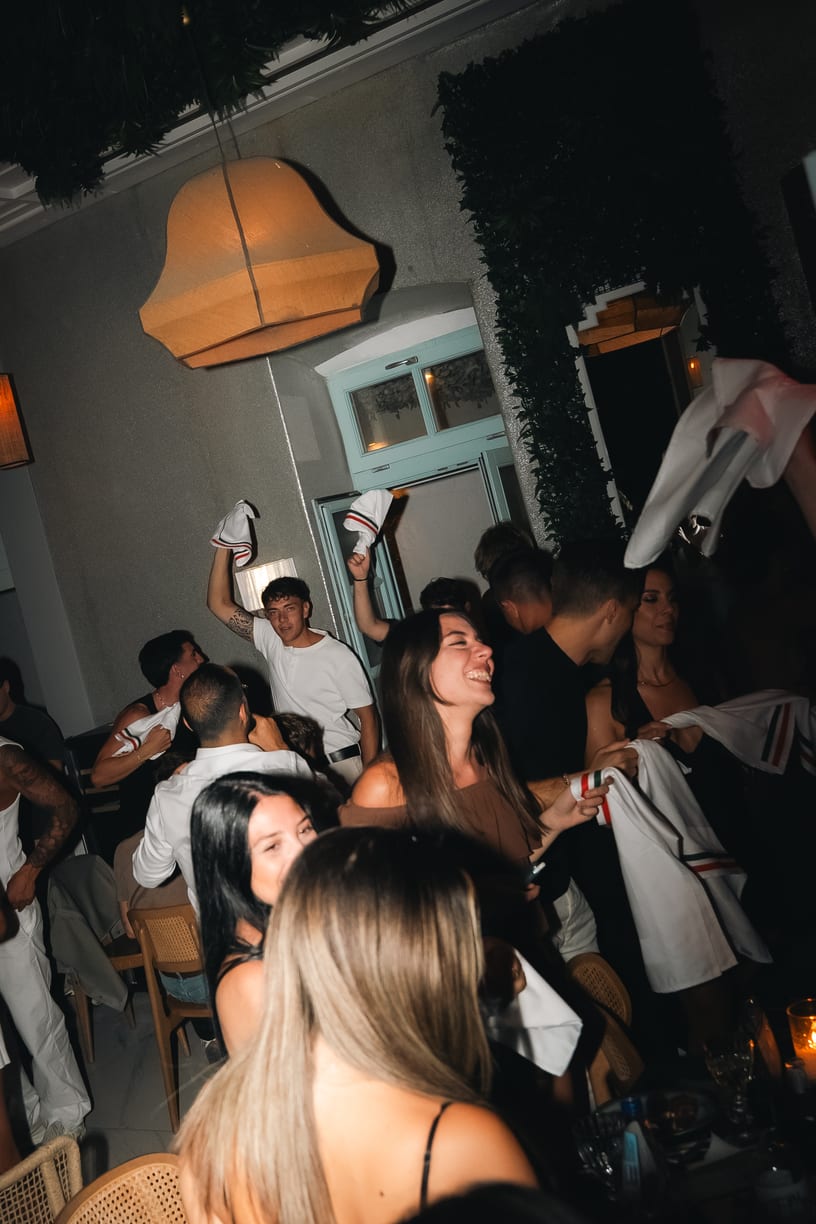 The whole room on its feet, napkins waving.