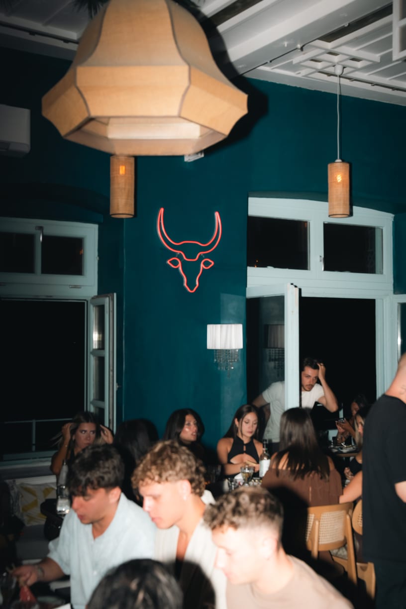 The blue dining room and the neon bull, early in the evening.